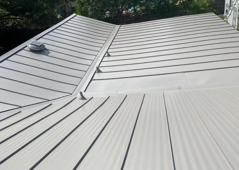 Solar attic fan installed on a metal roof for Roof Ventilation in Catalina
